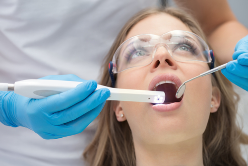 Dentist using intraoral camera at Mitcham Central Dental